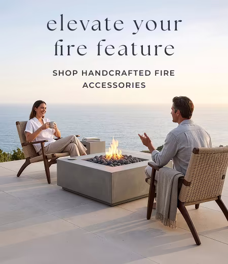 Couple sitting by outdoor fire pit. Image Text: elevate your fire feature SHOP HANDCRAFTED FIRE ACCESSORIES