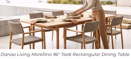 Person setting outdoor wooden dining table. Image Text: Danao Living Morellino 96" Teak Rectangular Dining Table