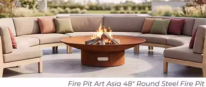 Corten steel Fire Pit Art Asia round fire pit with burning logs surrounded by curved outdoor seating.