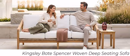 Couple sits on outdoor sofa. Image Text: Kingsley Bate Spencer Woven Deep Seating Sofa